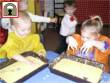 Nursery school children getting messy!